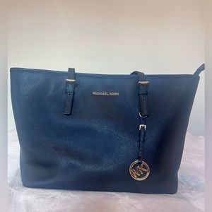 Black Michael Kors purse with gold tone hardware. Lightly used.